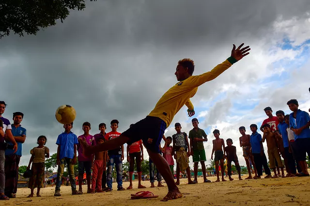 in this picture taken on july 19 2018 mohammad jahangir alam a fan of brazilian footballer neymar shows his football skills at the kutupalong refugee camp in ukhia the world cup may be over but passion for the game burns bright in the world 039 s largest refugee camp where brazil and argentina flags still flutter alongside the red and green of bangladesh which hosts nearly a million rohingya muslims forced out of myanmar photo afp in this picture taken on july 19 2018 mohammad jahangir alam a fan of brazilian footballer neymar shows his football skills at the kutupalong refugee camp in ukhia the world cup may be over but passion for the game burns bright in the world 039 s largest refugee camp where brazil and argentina flags still flutter alongside the red and green of bangladesh which hosts nearly a million rohingya muslims forced out of myanmar photo afp