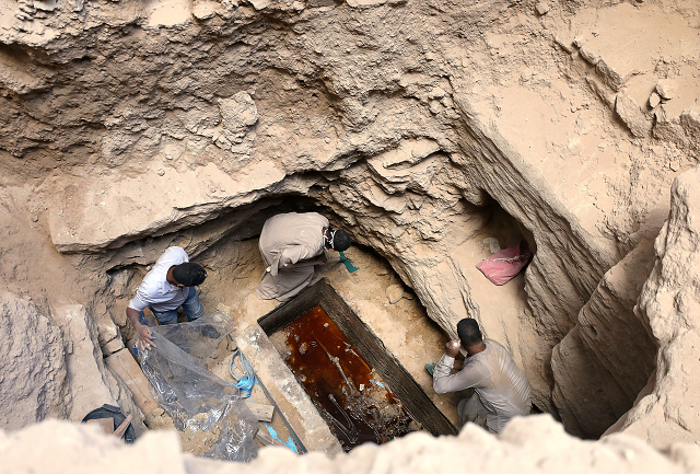 archaeologists unearth coffin containing three mummies with sewage water and bones inside in alexandria egypt photo reuters archaeologists unearth coffin containing three mummies with sewage water and bones inside in alexandria egypt photo reuters
