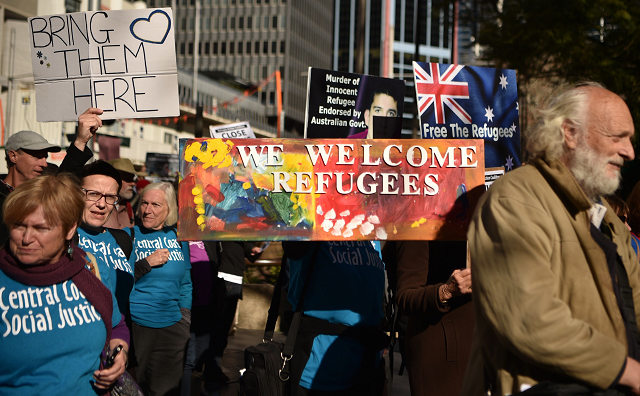 demonstrators march during a protest to demand humane treatment of asylum seekers and refugees in sydney photo afp demonstrators march during a protest to demand humane treatment of asylum seekers and refugees in sydney photo afp