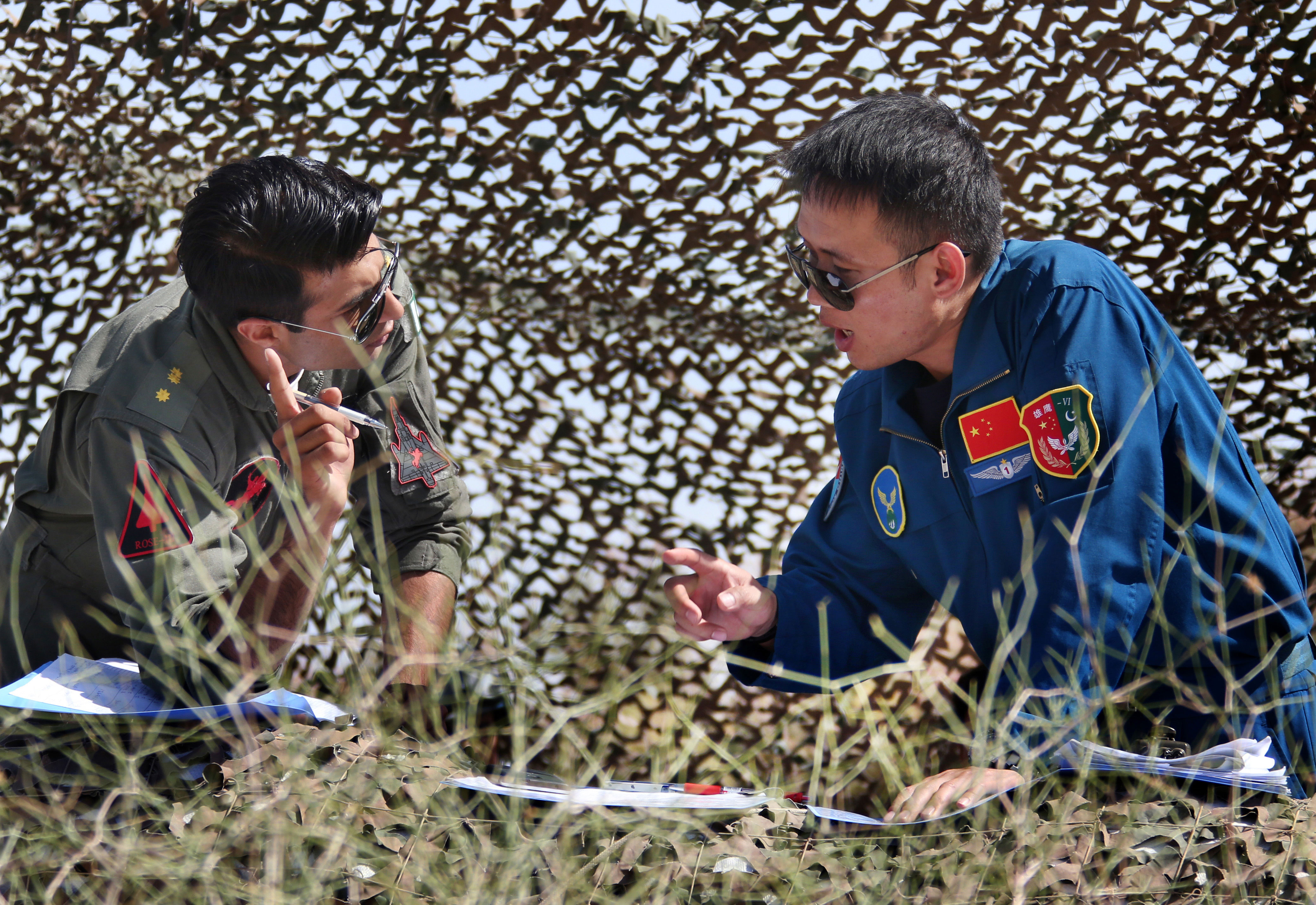 chinese and pakistani pilots discuss airstrike plan during the shaheen vi joint air training exercise photo china military online