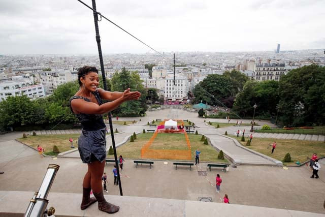 tightrope walker tatian mosio bongonga reacts after she scaled the monmartre hill towards the sacre coeur basilica not pictured on a tightrope in paris france july 20 2018 photo reuters tightrope walker tatian mosio bongonga reacts after she scaled the monmartre hill towards the sacre coeur basilica not pictured on a tightrope in paris france july 20 2018 photo reuters