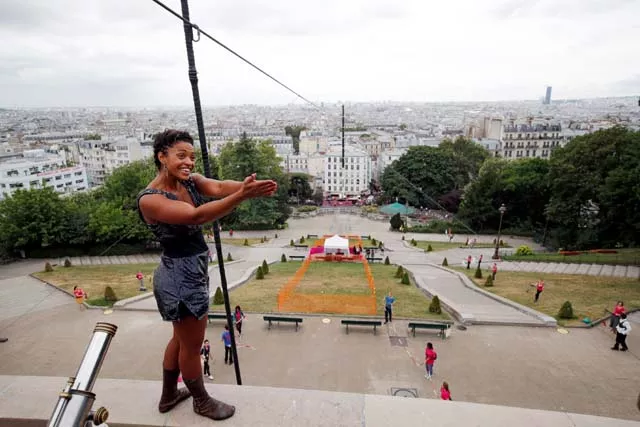 tightrope walker tatian mosio bongonga reacts after she scaled the monmartre hill towards the sacre coeur basilica not pictured on a tightrope in paris france july 20 2018 photo reuters tightrope walker tatian mosio bongonga reacts after she scaled the monmartre hill towards the sacre coeur basilica not pictured on a tightrope in paris france july 20 2018 photo reuters