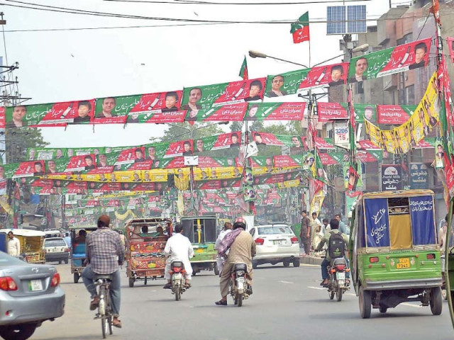 banners of political parties are on display on allama iqbal road in lahore photo online banners of political parties are on display on allama iqbal road in lahore photo online