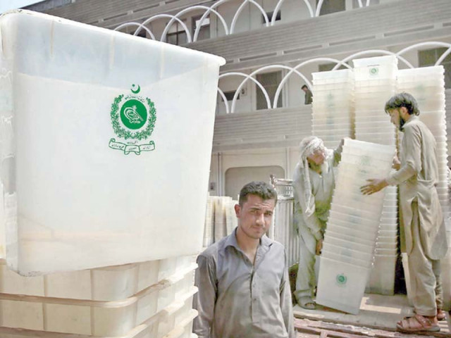 workers of ecp load ballot boxes in peshawar on monday photo ppi workers of ecp load ballot boxes in peshawar on monday photo ppi