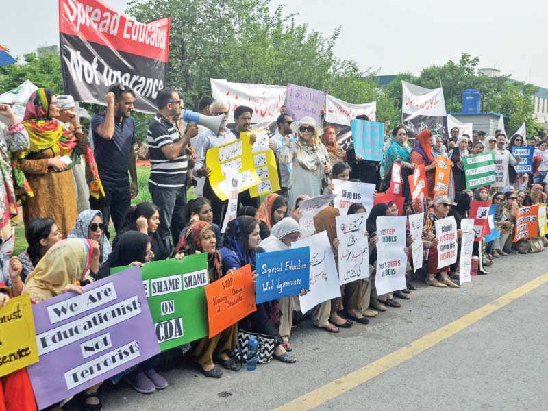 members of all pakistan private schools and colleges association hold protest against cda sealing schools in islamabad photo zafar aslam express