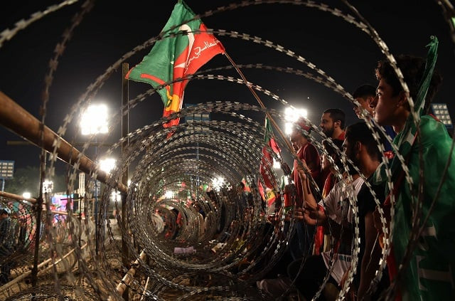 barbed wire at a pti jalsa photo afp barbed wire at a pti jalsa photo afp