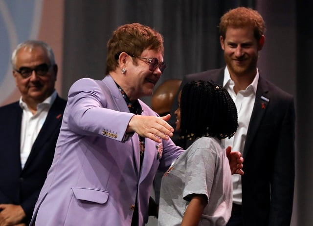 british musician elton john embraces a participant as britain 039 s prince harry looks on during a panel quot breaking barriers of inequity in the hiv response quot during the 22nd international aids conference aids 2018 photo reuters british musician elton john embraces a participant as britain 039 s prince harry looks on during a panel quot breaking barriers of inequity in the hiv response quot during the 22nd international aids conference aids 2018 photo reuters