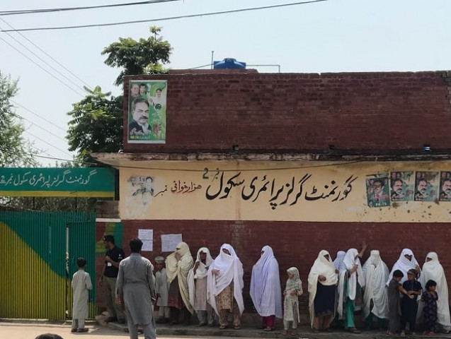 women stand in line to vote in peshawar s hazar khwani area photo express women stand in line to vote in peshawar s hazar khwani area photo express