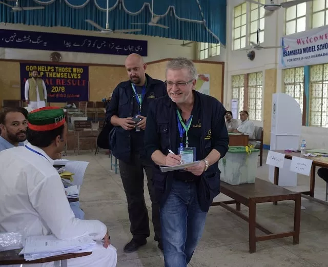 european union election observer officials speak to political parties agents at a polling station during pakistan 039 s general election in islamabad on july 25 2018 photo afp european union election observer officials speak to political parties agents at a polling station during pakistan 039 s general election in islamabad on july 25 2018 photo afp