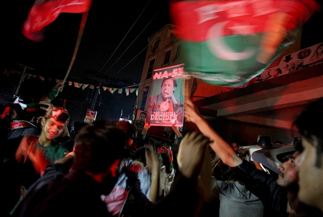 a supporter of imran khan chairman of the pakistan tehreek e insaf pti political party celebrates during the general election in rawalpindi pakistan july 25 2018 photo reuters