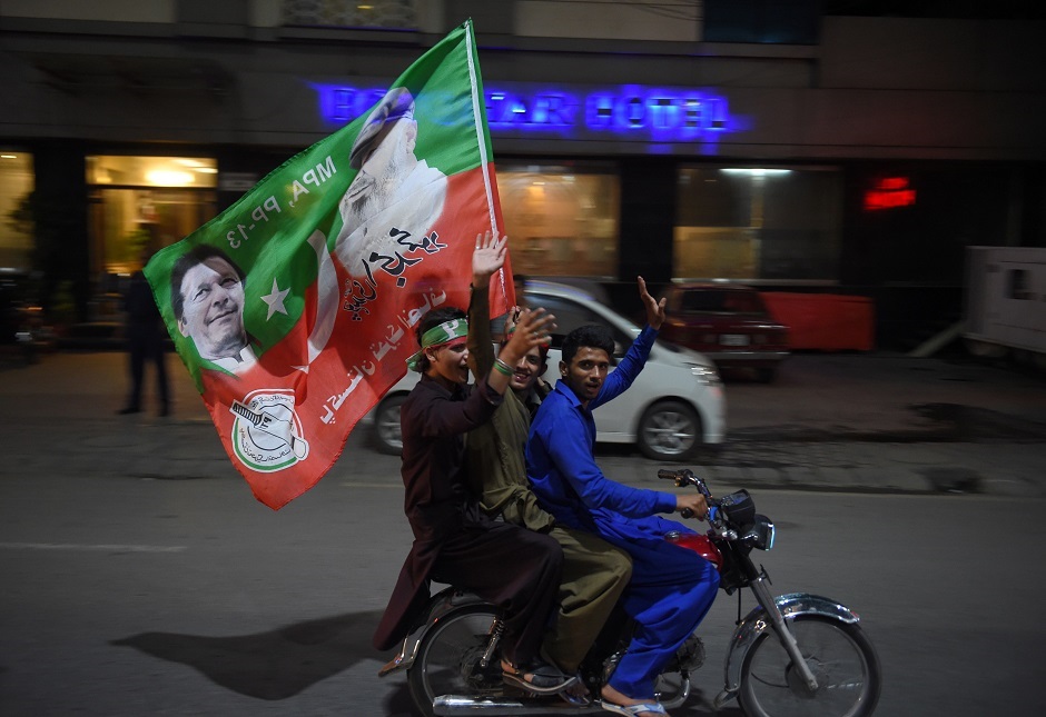 supporters of pakistan 039 s cricketer turned politician imran khan head of the pakistan tehreek e insaf movement for justice party ride on a motorcycle as they celebrate in rawalpindi on july 25 2018 after voting closed in a general election vote counting was ongoing on july 25 in a knife edge pakistan general election as former cricket hero imran khan sought power on a day marred by a bloody suicide bombing and claims of military interference photo afp