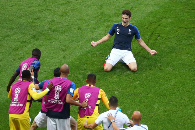 leaning back and striking the ball on the half volley with the outside of his boot pavard generated vicious top spin which took it beyond the reach of the argentinian goalkeeper photo afp