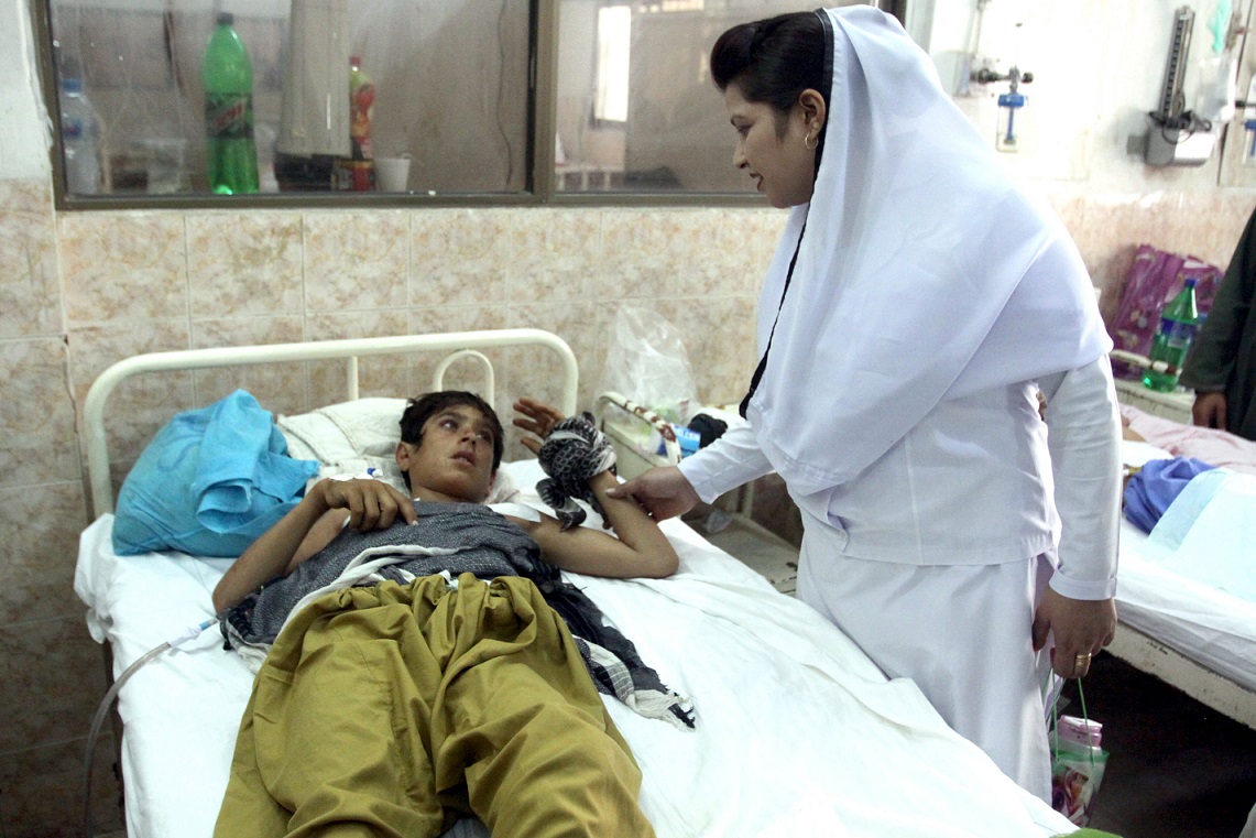 a nurse attends to a boy injured in the suicide attack near the quetta polling station at the civil hospital photo express