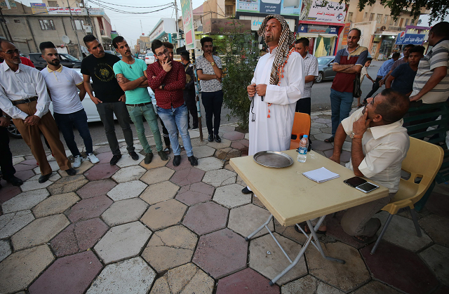 iraqi man performs on the streets of kut photo afp