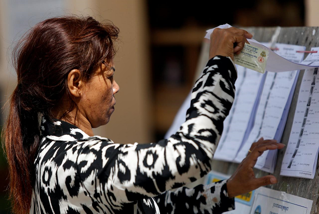 a voter looks at a voters list during a general election in phnom penh cambodia july 29 2018 photo reuters