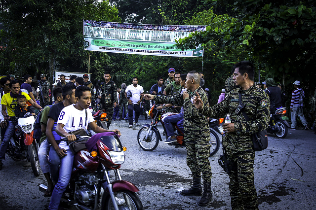 moro islamic liberation front milf members secure camp darapanan in sultan kudarat maguindanao on the southern island of mindanao on july 29 2018 nearly 100 000 members of the philippines 039 largest muslim rebel group gathered on july 29 to discuss a landmark law granting them autonomy expressing hope it would make their quot dream of peace quot a reality photo afp moro islamic liberation front milf members secure camp darapanan in sultan kudarat maguindanao on the southern island of mindanao on july 29 2018 nearly 100 000 members of the philippines 039 largest muslim rebel group gathered on july 29 to discuss a landmark law granting them autonomy expressing hope it would make their quot dream of peace quot a reality photo afp
