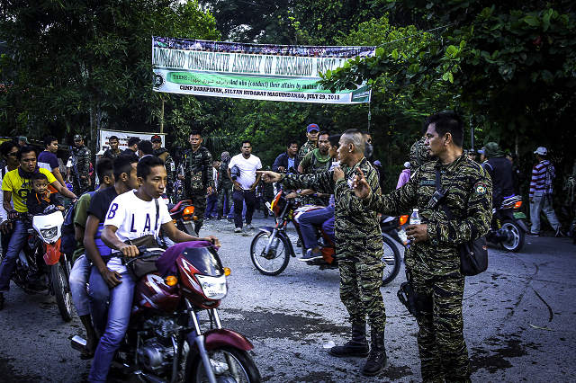 moro islamic liberation front milf members secure camp darapanan in sultan kudarat maguindanao on the southern island of mindanao on july 29 2018 nearly 100 000 members of the philippines 039 largest muslim rebel group gathered on july 29 to discuss a landmark law granting them autonomy expressing hope it would make their quot dream of peace quot a reality photo afp