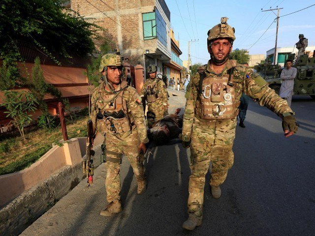 afghan security forces carry the body of a victim after an attack at a midwife training center in jalalabad city afghanistan july 28 2018 photo reuters