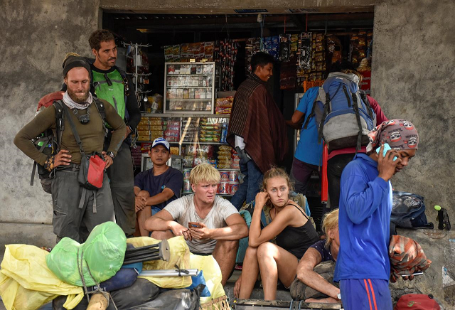 indonesian and foreign climbers are seen after walking down from rinjani mountain at sembalun village in lombok timur indonesia july 29 2018 photo reuters