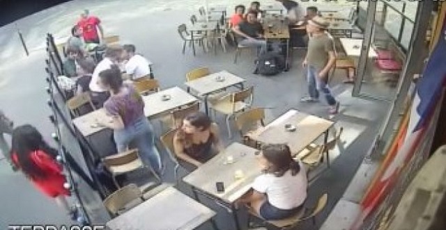 in surveillance video the man is seen grabbing an ash tray from a table on the cafe 039 s patio and throwing it at her cctv screengrab