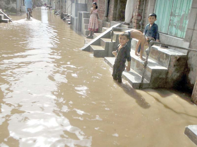 rainwater accumulated at a street in chiniot photo online rainwater accumulated at a street in chiniot photo online