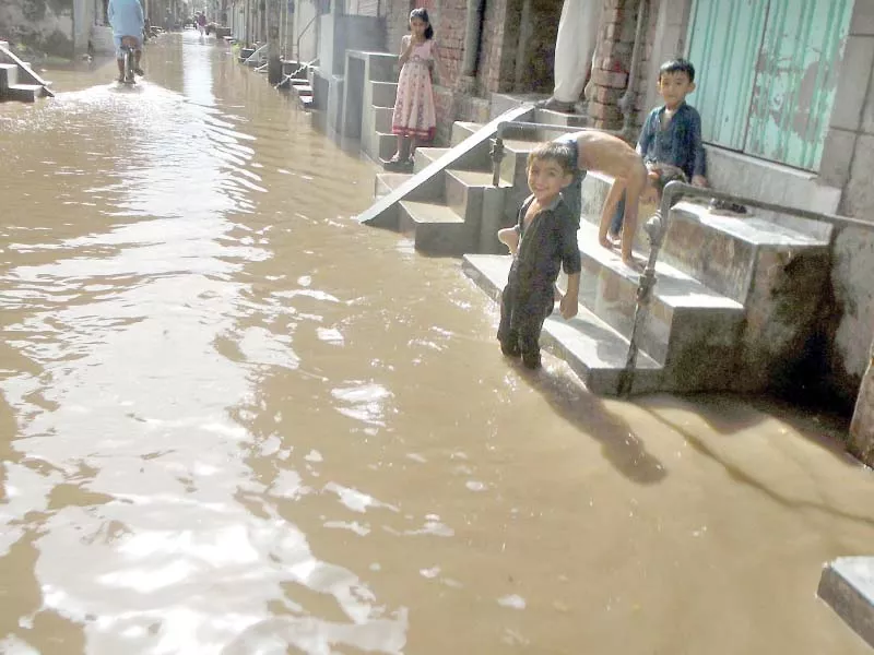 rainwater accumulated at a street in chiniot photo online rainwater accumulated at a street in chiniot photo online