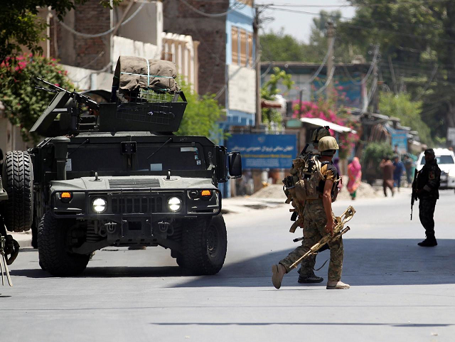 as security forces closed off the area gunshots could be heard and a clouds of black smoke spiraled into the sky above the area photo reuters