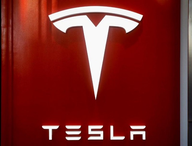 the tesla logo is seen at the entrance to tesla motors 039 new showroom in manhattan 039 s meatpacking district in new york city us december 14 2017 photo reuters