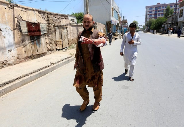 an injured man leaves the area where explosions and gunshots were heard in jalalabad city afghanistan july 31 2018 photo afp an injured man leaves the area where explosions and gunshots were heard in jalalabad city afghanistan july 31 2018 photo afp