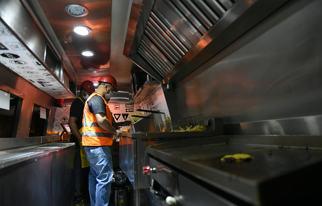 bader al ajmi 38 owner of one way burger cooking food at his truck at a main street in the capital riyadh photo afp bader al ajmi 38 owner of one way burger cooking food at his truck at a main street in the capital riyadh photo afp