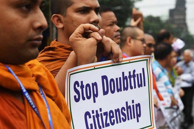 social activists hold posters during a protest following the publication of a draft of the national register of citizens in kolkata on august 1 2018 photo afp social activists hold posters during a protest following the publication of a draft of the national register of citizens in kolkata on august 1 2018 photo afp