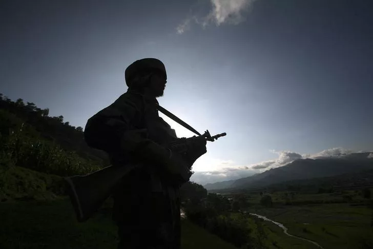 an indian army soldier stands guard while patrolling near the line of control photo reuters file an indian army soldier stands guard while patrolling near the line of control photo reuters file