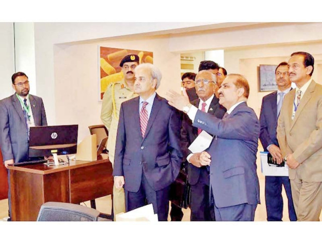 caretaker prime minister justice retd nasirul mulk is being briefed during his visit to national institute for health photo nni caretaker prime minister justice retd nasirul mulk is being briefed during his visit to national institute for health photo nni