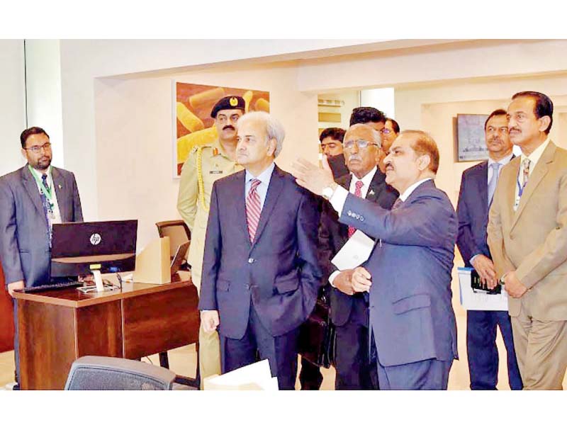 caretaker prime minister justice retd nasirul mulk is being briefed during his visit to national institute for health photo nni