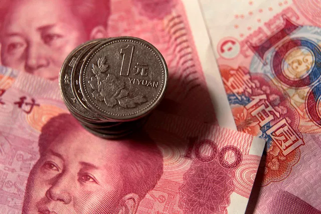 chinese one yuan coins are placed on 100 yuan banknotes in this illustrative photograph taken in beijing december 30 2010 photo reuters chinese one yuan coins are placed on 100 yuan banknotes in this illustrative photograph taken in beijing december 30 2010 photo reuters
