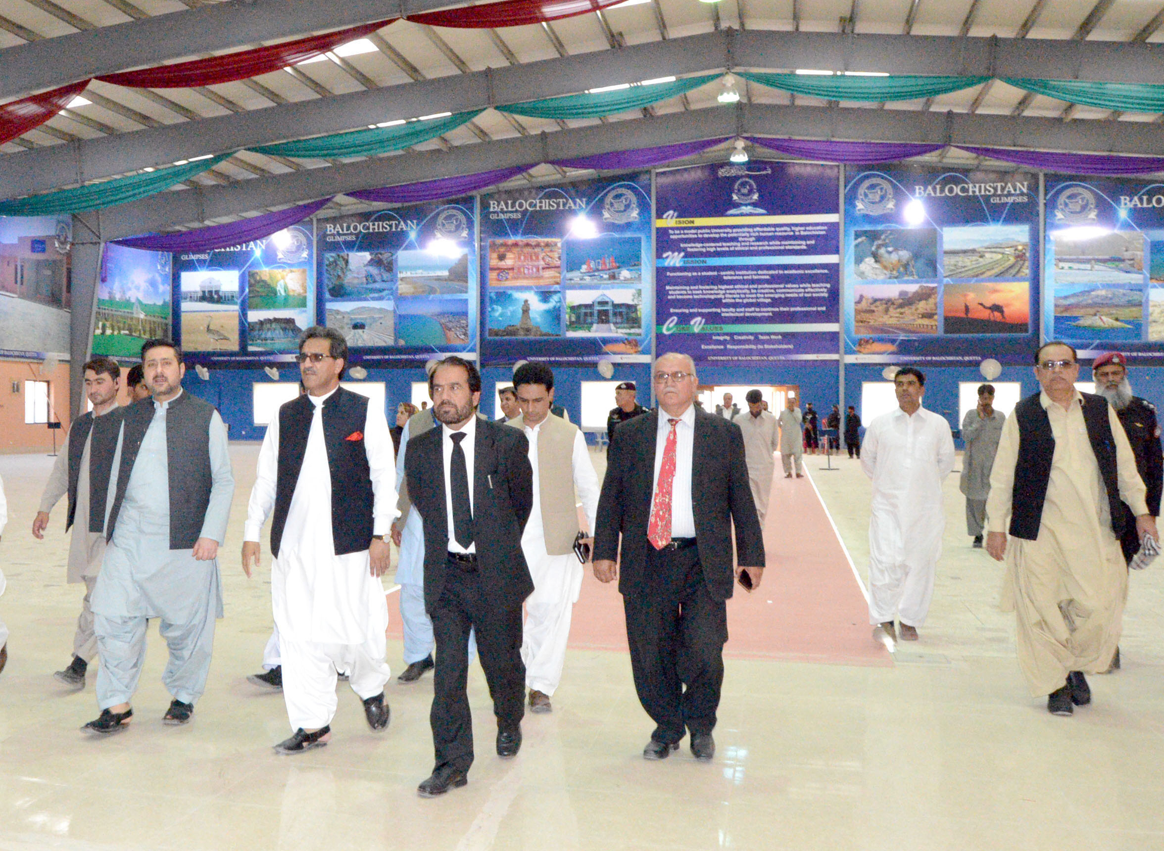 caretaker balochistan chief minister alauddin marri and balochistan high court chief justice noor muhammad meskanzai take a tour of the expo centre at the university of balochistan photo express