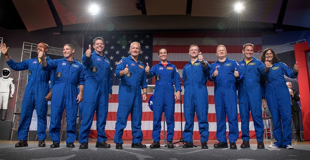 shows the first us astronauts who will fly on american made commercial spacecraft to and from the international space station waving after being announced photo afp