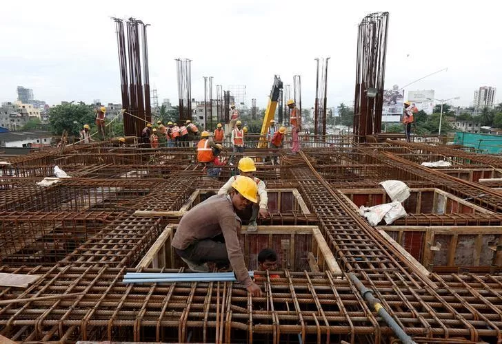 labourers work at the construction site photo reuters labourers work at the construction site photo reuters