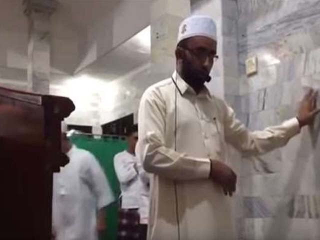 the video which was recorded on a smartphone shows him supporting himself against the wall as the room violently shudders while some worshipers can be seen fleeing in the backdrop screengrab youtube