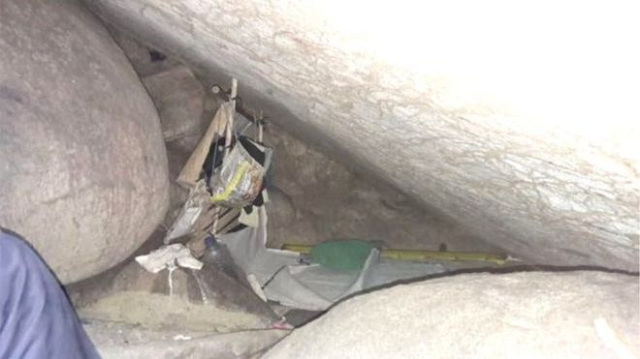 the woman was found in a small space behind boulders in the cave photo courtesy bbc indonesia police handout the woman was found in a small space behind boulders in the cave photo courtesy bbc indonesia police handout