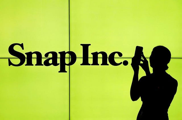 a woman stands in front of the logo of snap on the floor of the new york stock exchange nyse while waiting for snap to post their ipo in new york city new york us on march 2 2017 photo reuters a woman stands in front of the logo of snap on the floor of the new york stock exchange nyse while waiting for snap to post their ipo in new york city new york us on march 2 2017 photo reuters