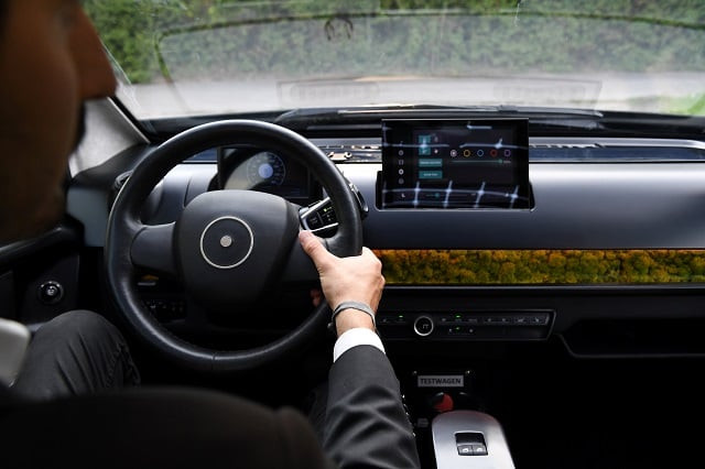 an employee of german solar car company sono motors holds the steering wheel of the prototype car quot sion quot in munich germany august 1 2018 photo reuters an employee of german solar car company sono motors holds the steering wheel of the prototype car quot sion quot in munich germany august 1 2018 photo reuters
