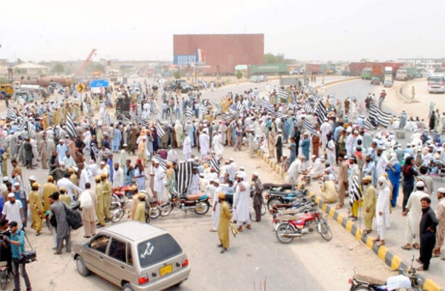 supporters of jui f staging a protest on hatri bypass in hyderabad photo ppi supporters of jui f staging a protest on hatri bypass in hyderabad photo ppi