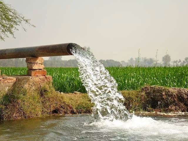 water gushes from a tube well photo express