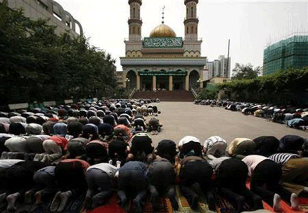 ethnic uighurs and han chinese muslims pray together photo reuters