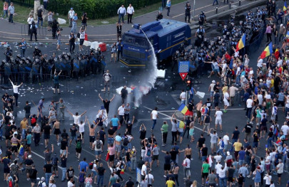 police fire tear gas as romanians rally against government police fire tear gas as romanians rally against government