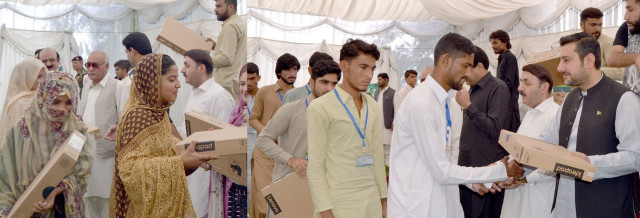 caretaker balochistan chief minister alauddin marri distributes laptops among students from makran photo express