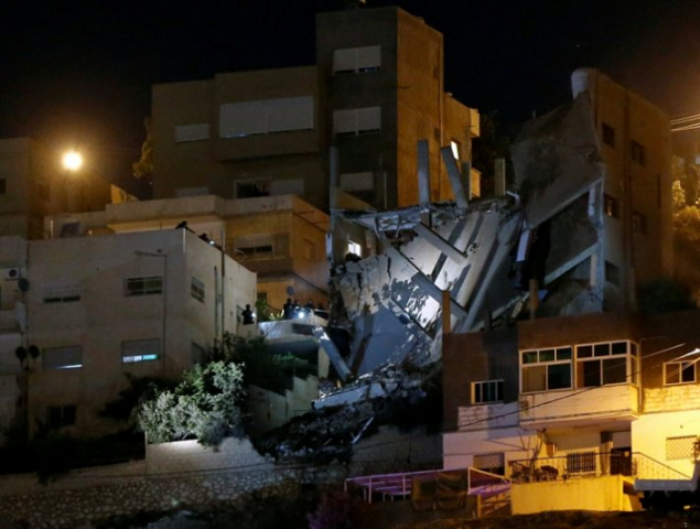 security forces are seen near a damaged building one day after the security incident at the city of al salt jordan august 11 2018 photo reuters security forces are seen near a damaged building one day after the security incident at the city of al salt jordan august 11 2018 photo reuters