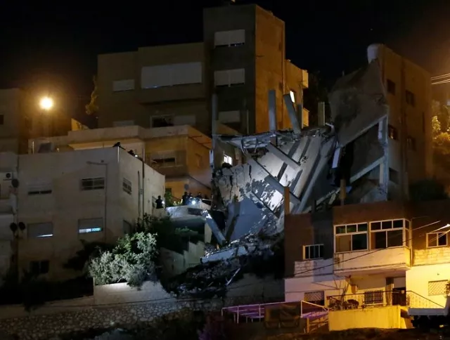 security forces are seen near a damaged building one day after the security incident at the city of al salt jordan august 11 2018 photo reuters security forces are seen near a damaged building one day after the security incident at the city of al salt jordan august 11 2018 photo reuters