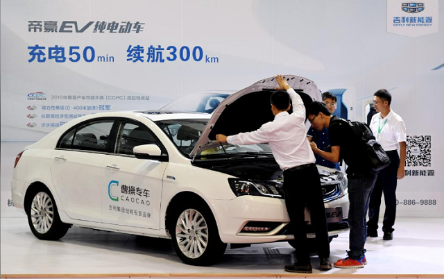 men look at an electric vehicle of caocao zhuanche a chauffeur ride hailing platform backed by zhejiang geely holding group at a new energy vehicle nev trade fair in zhengzhou henan province china september 23 2016 photo reuters men look at an electric vehicle of caocao zhuanche a chauffeur ride hailing platform backed by zhejiang geely holding group at a new energy vehicle nev trade fair in zhengzhou henan province china september 23 2016 photo reuters